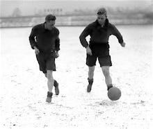 Bradford footballers train in snow, 1930s