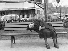 Bent lady on bench, Paris 1963