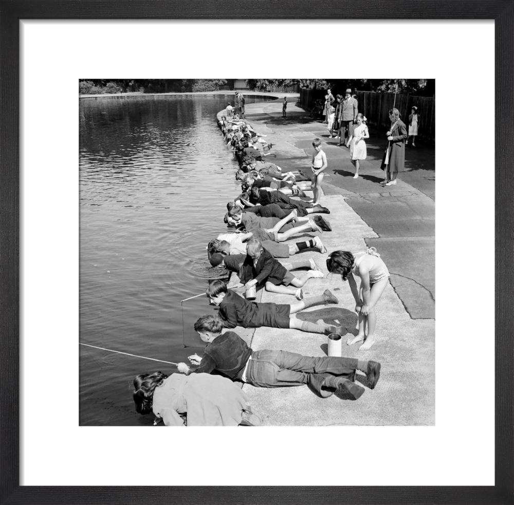 Children fishing in Victoria Park, London 1953